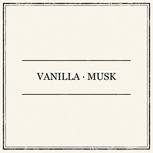 A square cream-colored textured card or label with a thin dark border and the words 'VANILLA • MUSK' centered between two horizontal lines in a black serif font.